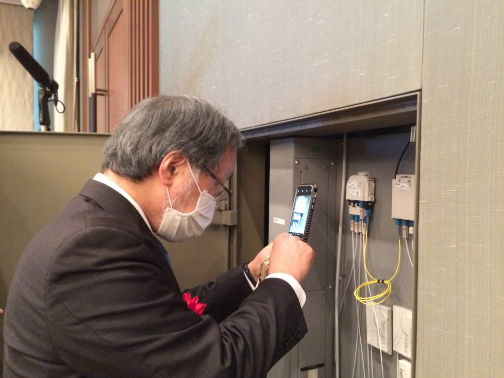 IEEE Past President Fukuda Observed the Optical Connectors Actually Used in the Meeting Room
